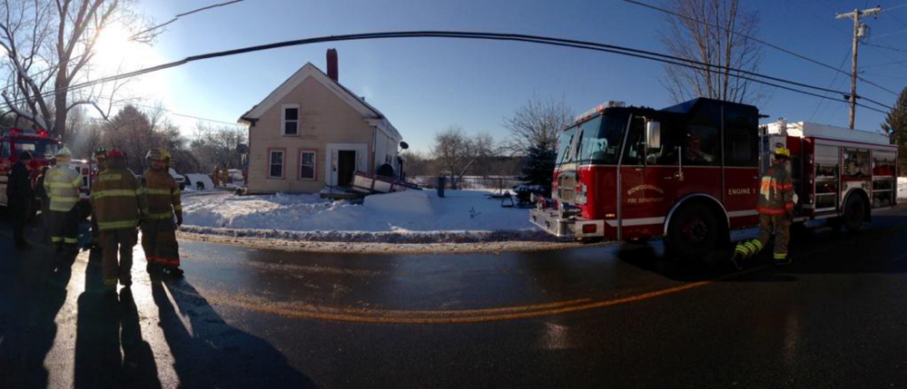 Firefighters from Richmond and other surrounding towns clean up after a house fire at 246 Main St.