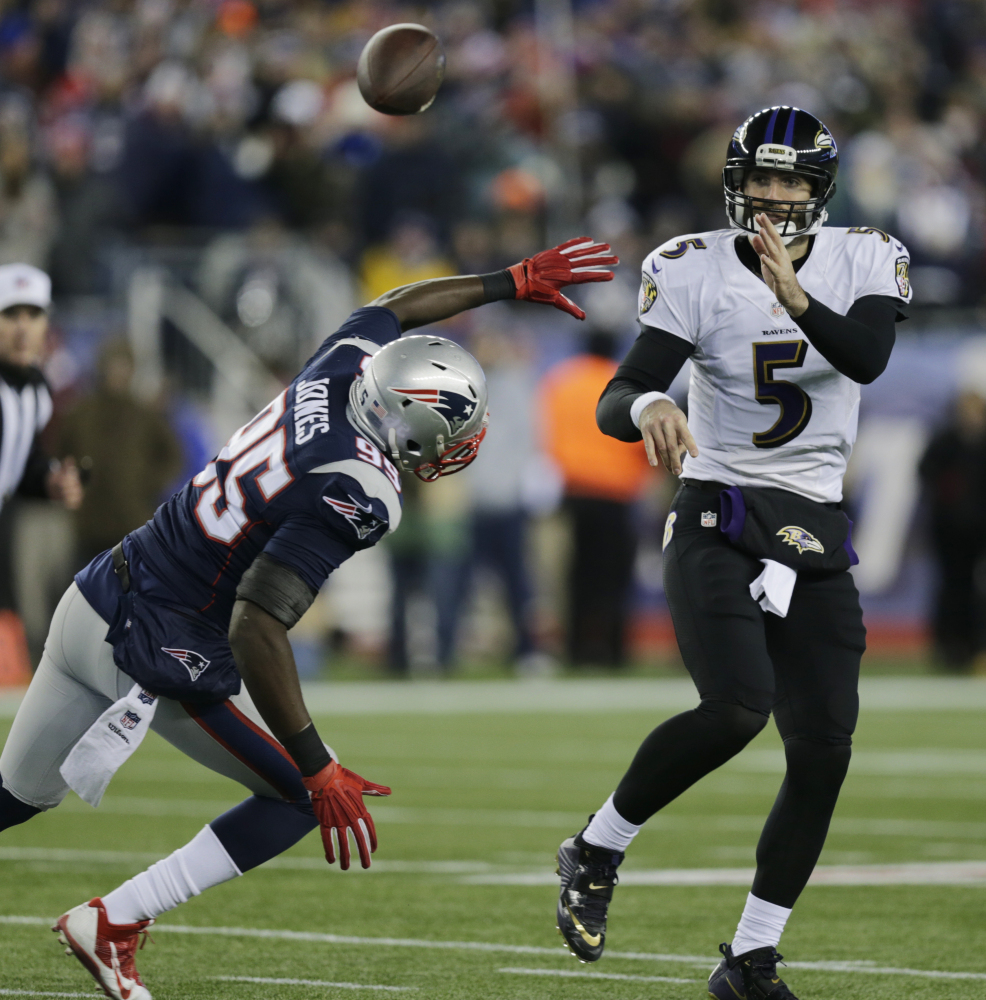 Baltimore Ravens quarterback Joe Flacco (5) passes over New England Patriots defensive end Chandler Jones (95) in the first half of a divisional playoff game last week in Foxborough, Mass.The Patriots play the Indianapolis Colts on Sunday in the AFC Championship game.