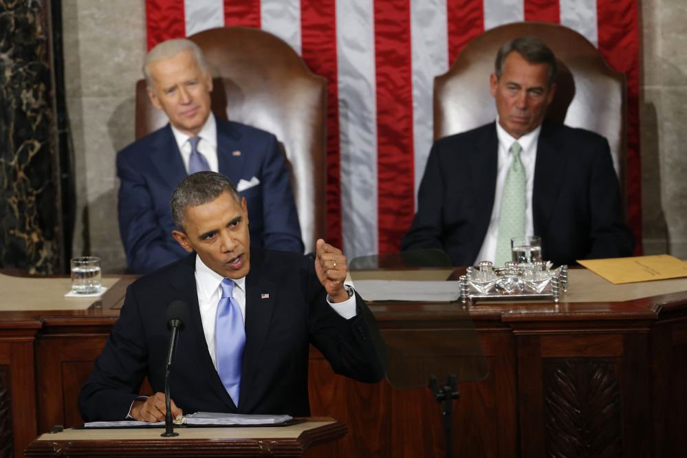 In this Jan. 28, 2014 photo, Vice President Joe Biden and House Speaker John Boehner of Ohio listens as President Barack Obama gives his State of the Union address on Capitol Hill in Washington. For the first time in his presidency, Obama stands before a Republican dominated Congress angry over his growing list of veto threats and opposed to the agenda he presents to them.