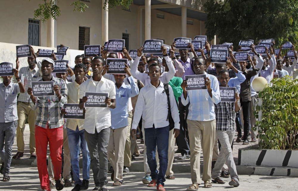 Somali University students carrying placards in French reading “I am Muslim, and I love my Prophet” march through the capital to protest depictions of the Prophet Muhammad in the French magazine Charlie Hebdo, in Mogadishu, Somalia on Saturday. Supporters say the cartoon on the cover of Charlie Hebdo is a defiant expression of free speech following a terrorist attack on the publication’s Paris offices that killed 12 people on Jan. 7, but many Muslims viewed it as another attack on their religion.