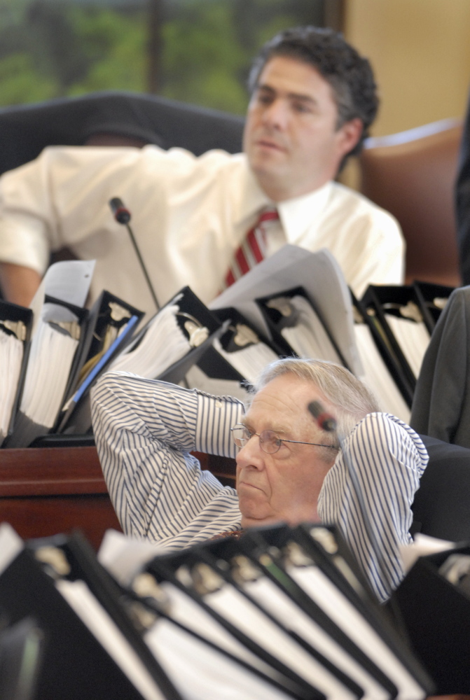 State Sens. Joseph Brannigan (front) and Ethan Strimling listen to debate during the session in Augusta on June 19, 2007..