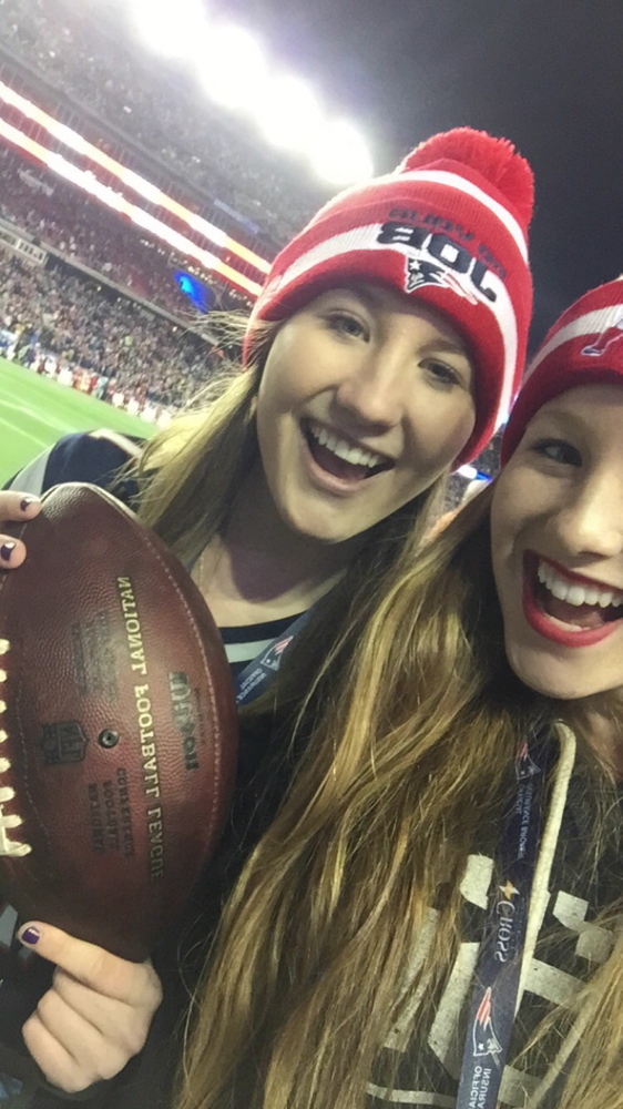 Contributed photo
Bethany Hammond, left, poses with her sister Sadie while holding a ball that was used in the AFC Championship game Sunday between the Colts and Patriots.