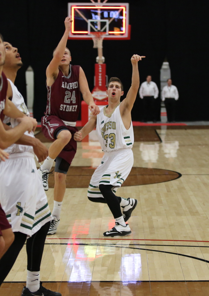 Husson University freshman Jordan Holmes, right, follows through on a shot at the buzzer in a game against Hampden-Sydney College on Dec. 29 in the D3hoops.com Classic at South Point Arena in Las Vegas. A graduate of Messalonskee High School, Holmes got his first collegiate start Jan. 10 in a 78-64 win over Maine Maritime.