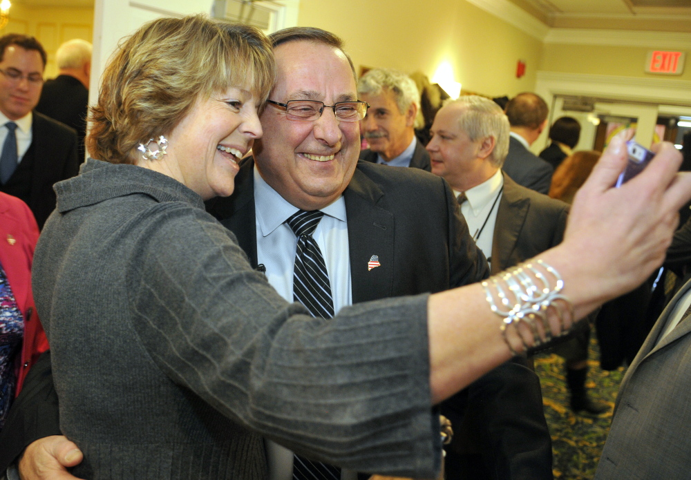 Jane Dennison takes a selfie with Gov. Paul LePage on Wednesday after he spoke to the Kennebec Valley Chamber of Commerce at the Senator Inn and Spa in Augusta.