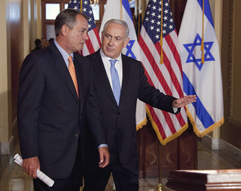 In this May 24, 2011 file photo, Israeli Prime Minister Benjamin Netanyahu walks with House Speaker  John Boehner of Ohio to make a statement on Capitol Hill in Washington. Boehner has invited Netanyahu to address Congress about Iran.