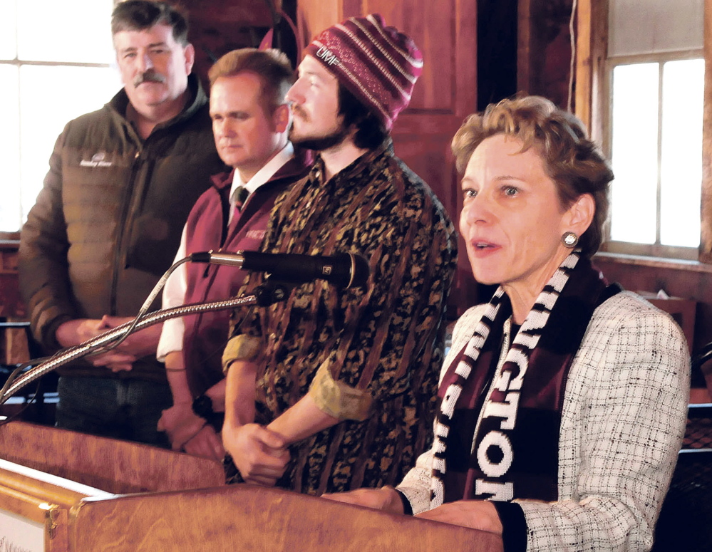 University of Maine at Farmington President Kathryn Foster announces the creation of the Alpine Operations Certificate program at Titcomb Mountain in Farmington on Wednesday. Also speaking, from left, are Dana Bullen, Clyde Mitchell and student Andre Panagore.