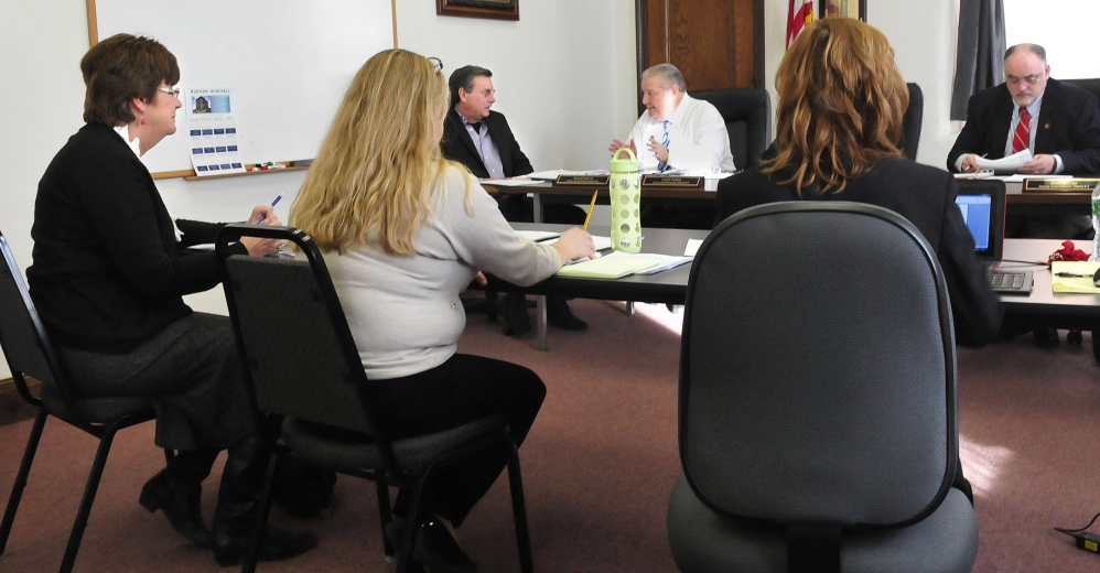 Patricia Dunn, left, an attorney representing the Somerset County Board of Commissioners, attends a meeting with commissioners before going into executive session to discuss the situation involving Registrar of Deeds Diane Grodin in Skowhegan. Commissioners in back from left are Newell Graf Jr., Lloyd Trafton and Phil Roy.
