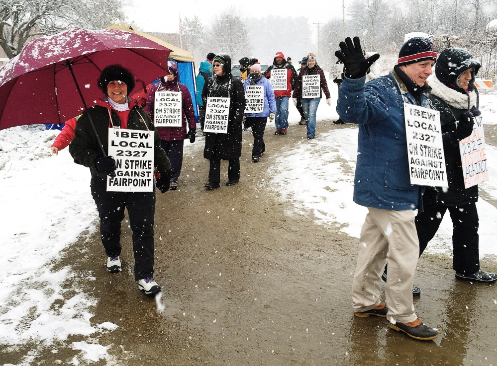 Strikers face heavy snowfall as they observe the 100th day of striking against FairPoint for a fair contract.