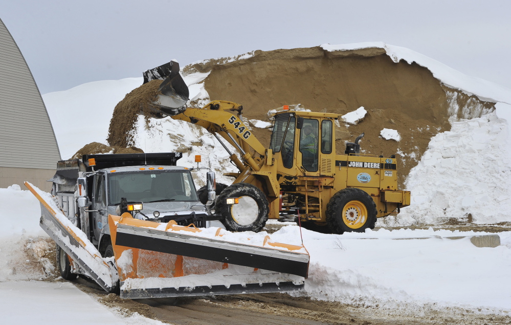Crews with Gorham Public Works load sand to be spread on icy town roads Wednesday morning as the region recovered from the winter’s most significant storm to date.