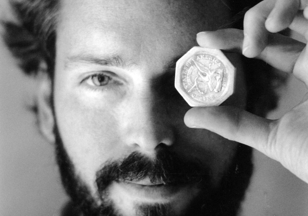 Tommy Thompson holds a $50 pioneer gold piece retrieved earlier in 1989 from the wreck of the gold ship SS Central America. Thompson, a fugitive treasure hunter wanted for more than two years, was arrested in Florida.