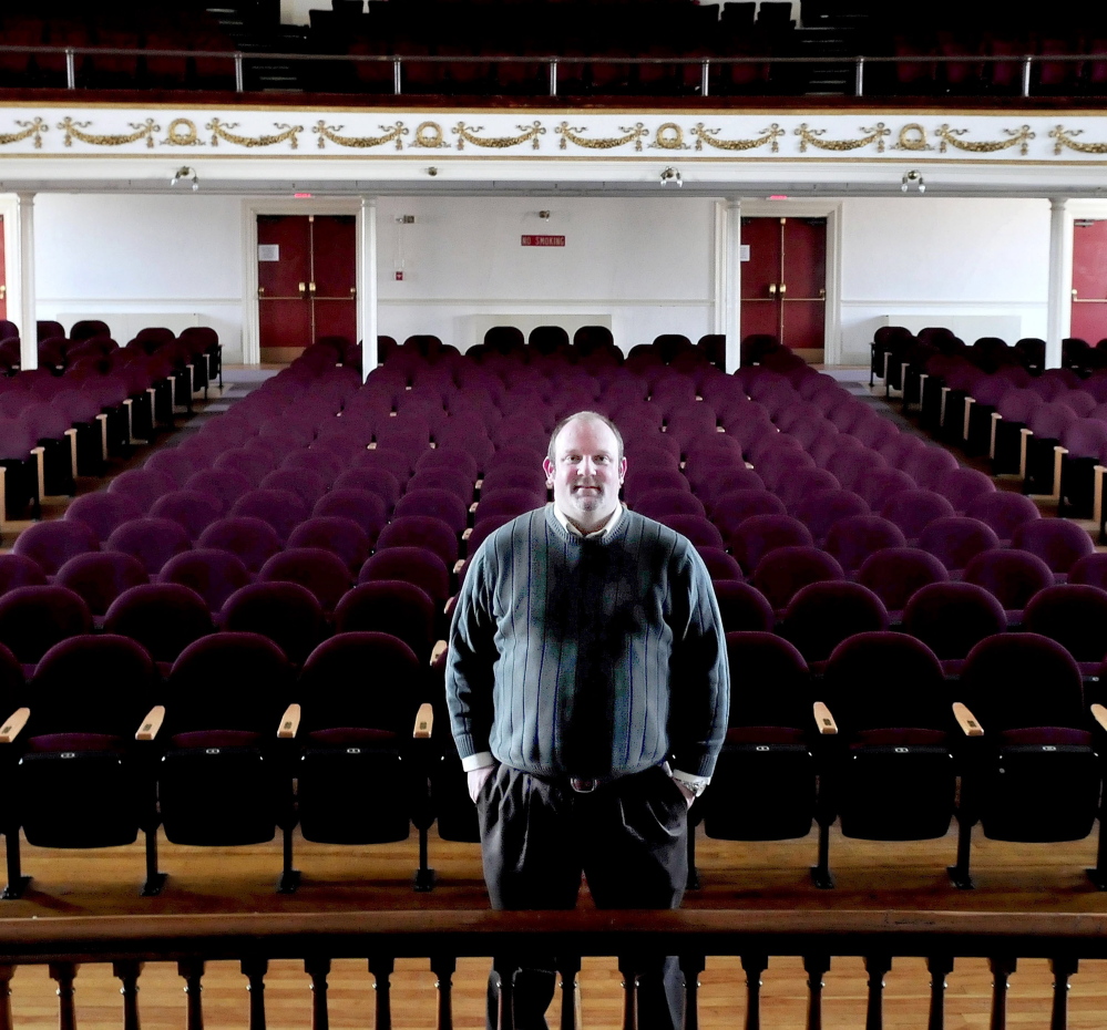 Skowhegan Area Chamber of Commerce Executive Director Cory King inside the Skowhegan Opera House. King said that the chamber plans to draw on its history during events this year, its 75th.