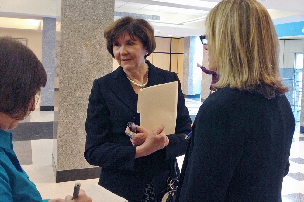 Former Maine CDC employee Sharon Leahy-Lind, center, has reached a settlement in a federal whistle-blower lawsuit against the state, as has Katie Woodbury, another former CDC employee. 2014 Press Herald File Photo/Eric Russell