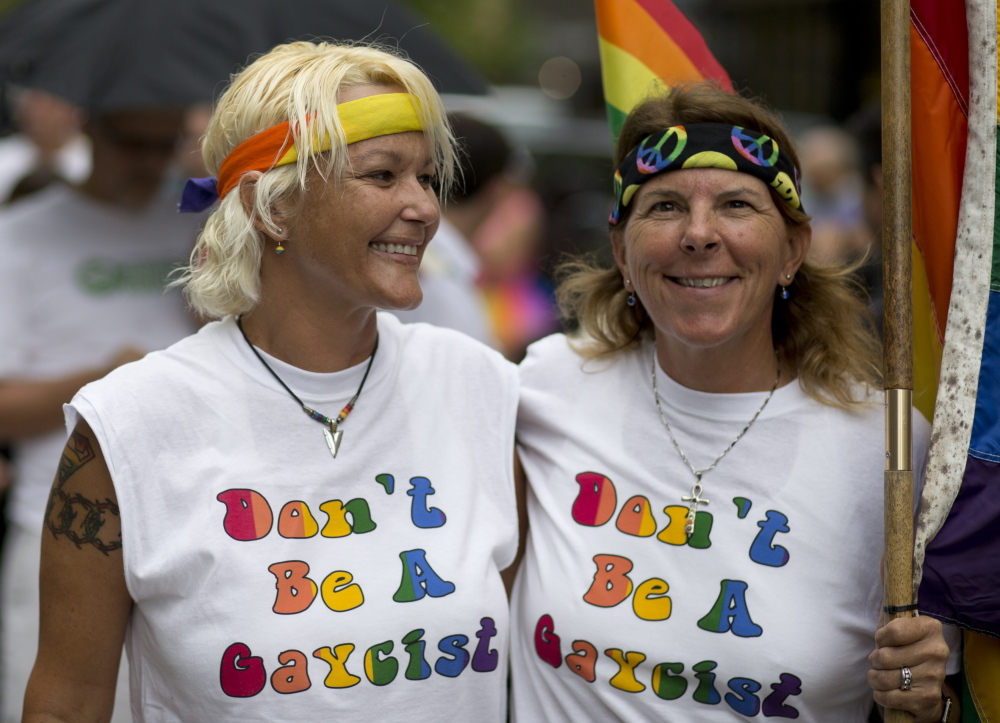 Kimmy Denny and Barb Lawrence of Palm Harbor, Fla., wait outside a gay marriage hearing in Miami last year.  Same-sex couples may soon be able to wed in Florida. The Associated Press