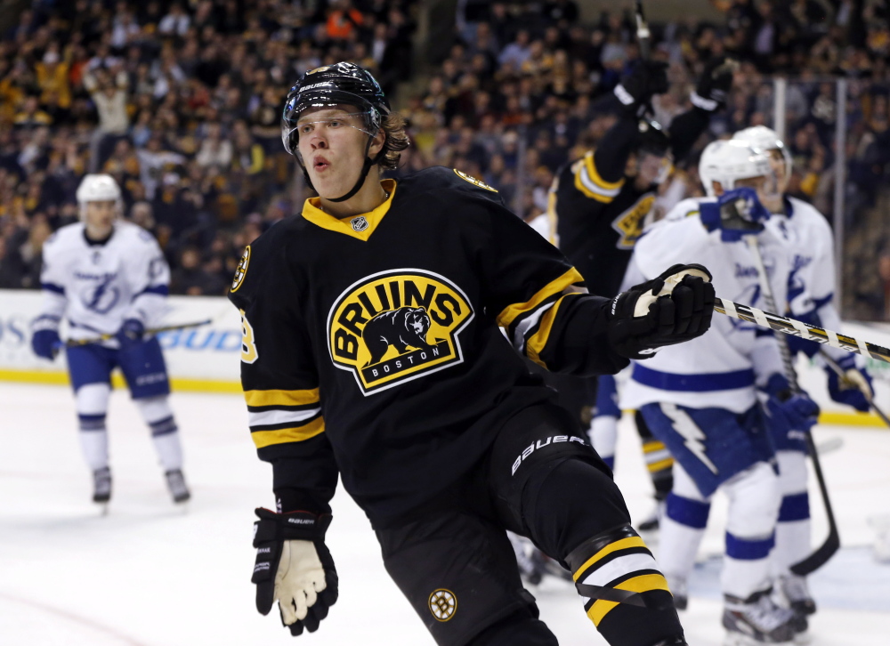 Boston Bruins left wing David Pastrnak celebrates a goal against the Tampa Bay Lightning during the second period of Tuesday night’s game in Boston. Pastrnak scored twice in the game. The Associated Press