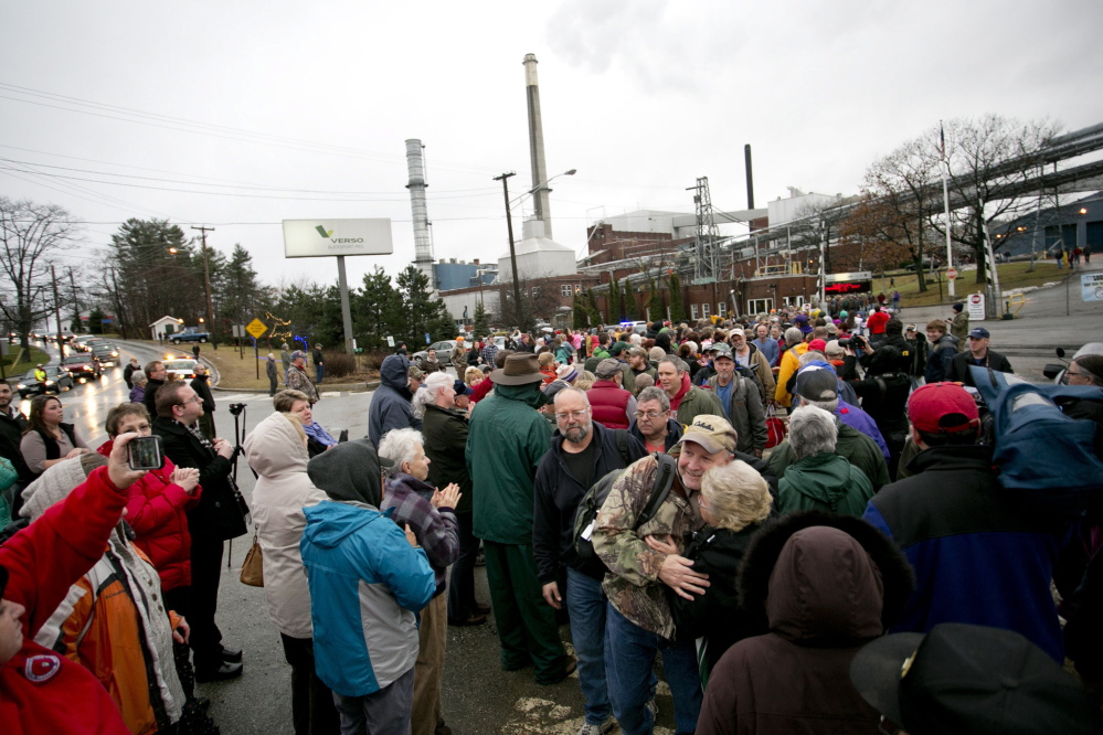 Hundreds of community members greet workers as they leave the Bucksport paper mill for the last time Dec. 17. In closing the 85-year-old mill, Verso Paper cited high energy costs and a shrinking market for the glossy paper that it produced for magazines and catalogs. 2014 Press Herald file/Gabe Souza