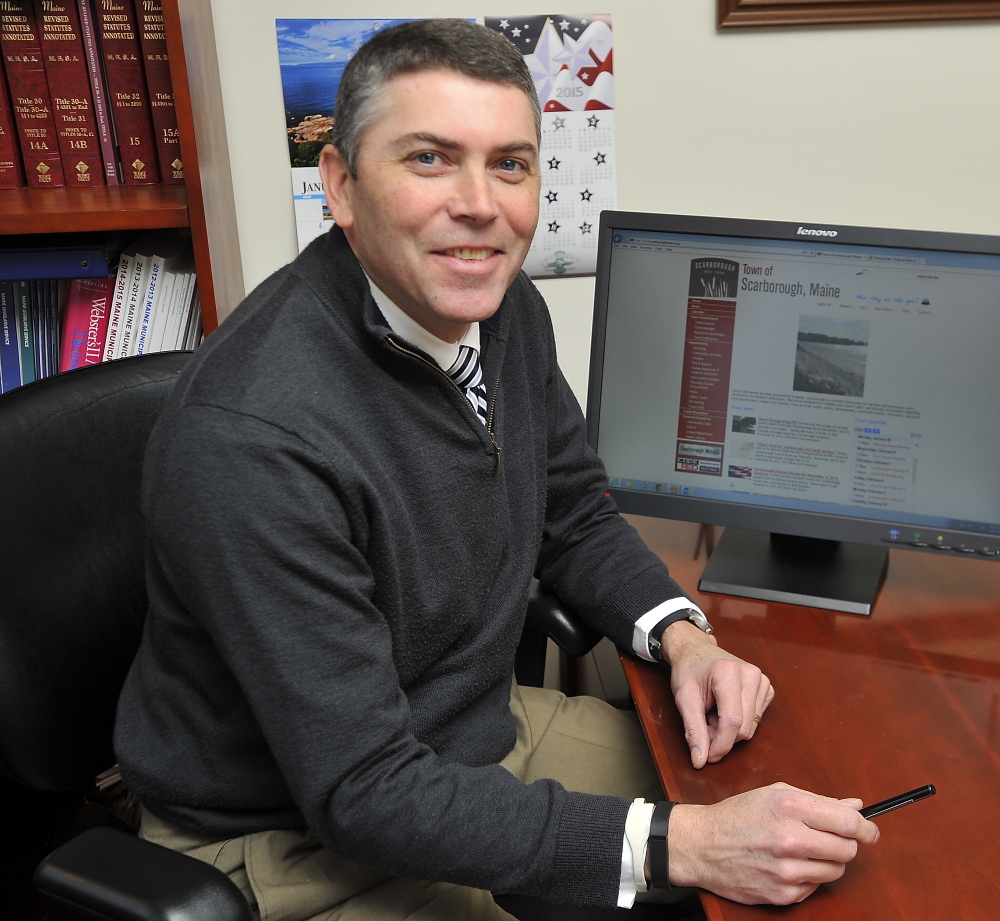 Scarborough Town Manager Tom Hall  is directing efforts to add Facebook and Twitter to the towns social site, as more municipal agencies in Maine are doing.  Staff photo by Gordon Chibroski