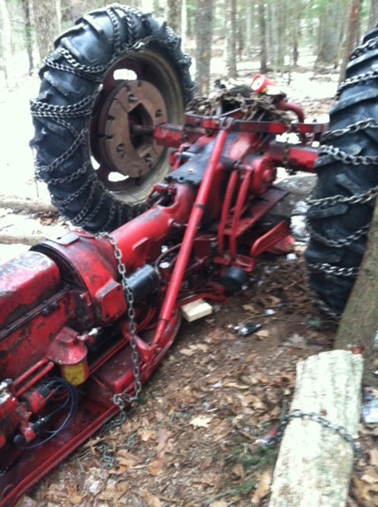 It took two hours to free a Greene man after he became trapped when this tractor overturned in Greene on Saturday. Courtesy Maine Department of Public Safety