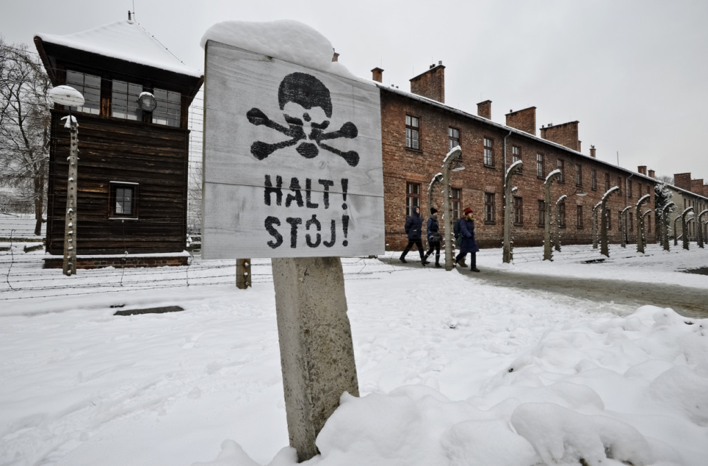Visitors walk at the Auschwitz Nazi death camp in Oswiecim, Poland, Monday. The Associated Press
