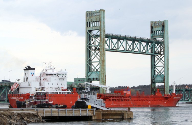 The 473-foot Harbour Feature rests against the Sarah Mildred Long Bridge on April 1, 2014 in Portsmouth, N.H. The Associated Press