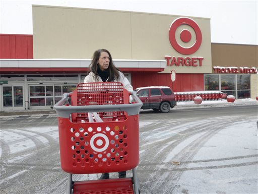 Joanne Coulombe leaves a Target store in Saint-Eustache, Quebec, on Thursday. Target Corp. Chairman and CEO Brian Cornell says the company was unable to find a way to make the Canadian operation profitable before 2021. The Associated Press