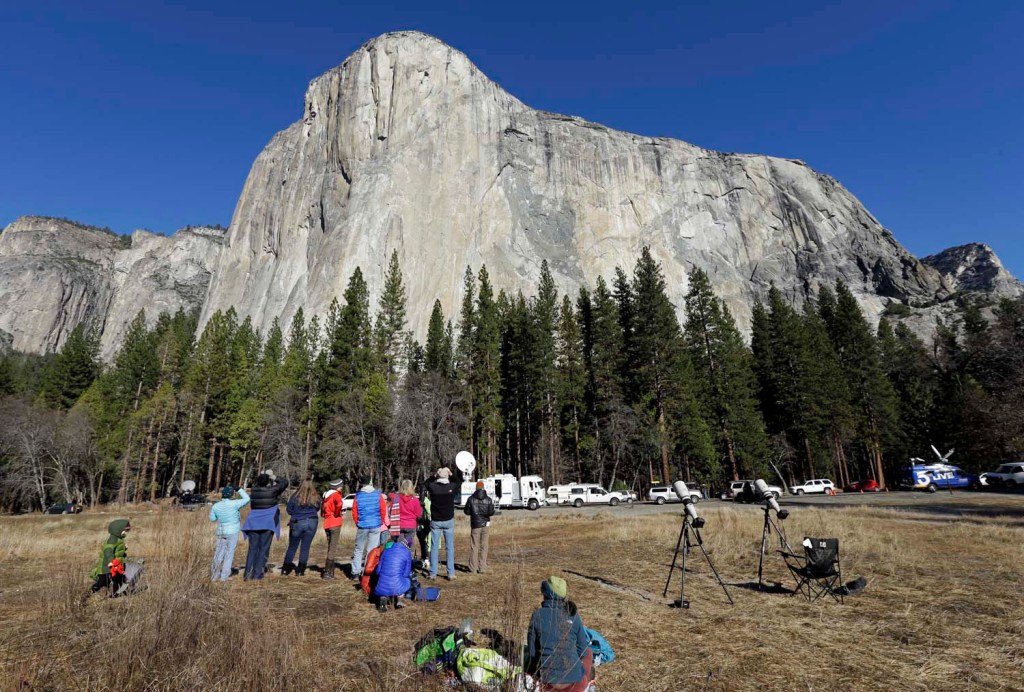 Spectators on the valley floor in Yosemite National Park, Calif. gaze at El Capitan for a glimpse of climbers Tommy Caldwell and Kevin Jorgeson on Wednesday. The Associated Press