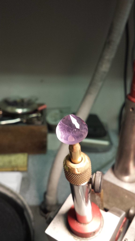 After pre-forming the gemstone undergoes the first steps in the polishing process. Photo courtesy of Creaser Jewelers
