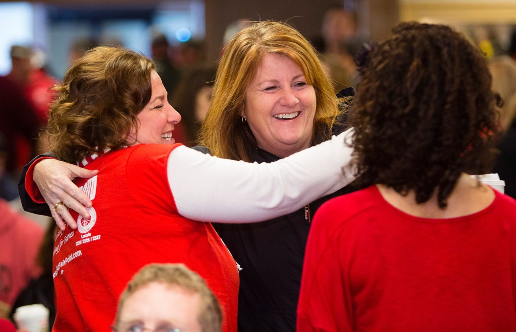 FairPoint striking employees Renee Dugas, left, and Erin Thibodeau embrace before a meeting to vote on a settlement at the Fireside Inn in Portland.