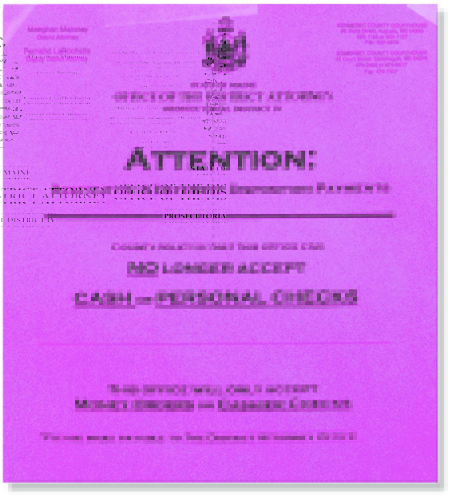 A sign at the Kennebec County Courthouse notifies people that they can no longer use cash when paying restitution or supervision fees to the district attorney’s office in Kennebec or Somerset counties.