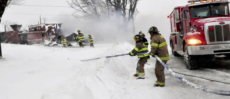 Firefighters from several departments had to deal with bitter temperatures and blowing snow to keep firehoses from freezing while battling a stubborn barn fire at the W.R. Sherburne and Sons dairy farm on Ripley Road in Dexter on Monday