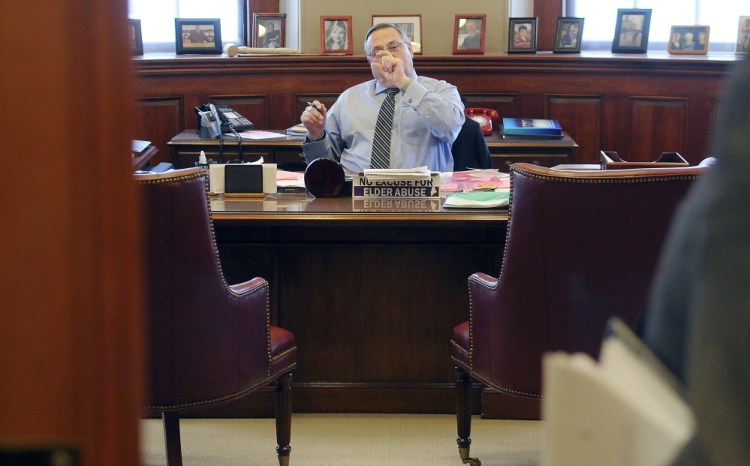 Gov. Paul LePage discusses a proposal he intends to make while drafting his State of the State speech with staff at his office in Augusta on Monday. LePage will present the address before a joint session of the Legislature tonight. LePage said he plans to outline a transformation of the state tax code during the speech.