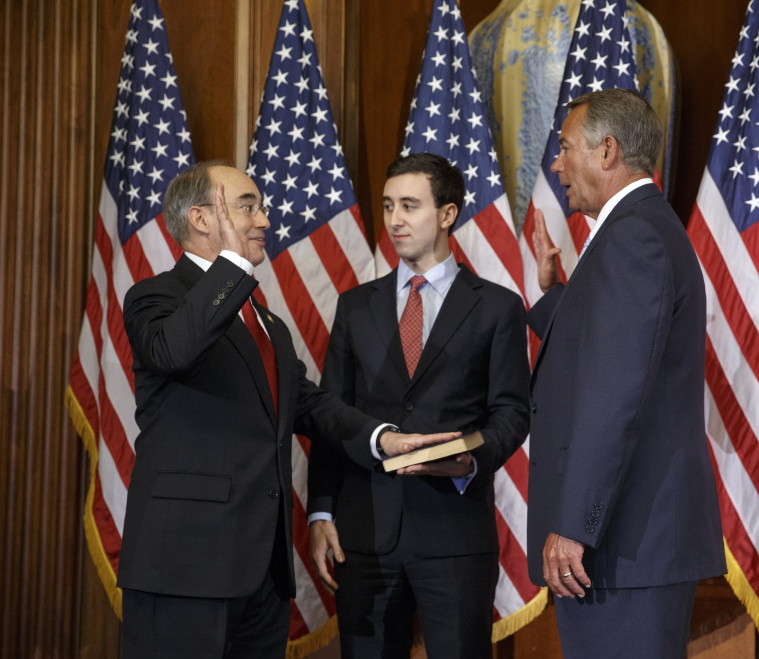 2nd District U.S. Rep. Bruce Poliquin, left, with his son Sam, center, is sworn in by House Speaker John Boehner on Jan. 6. Poliquin bucked his own party by voting against the most recent Republican proposal to repeal Obamacare.