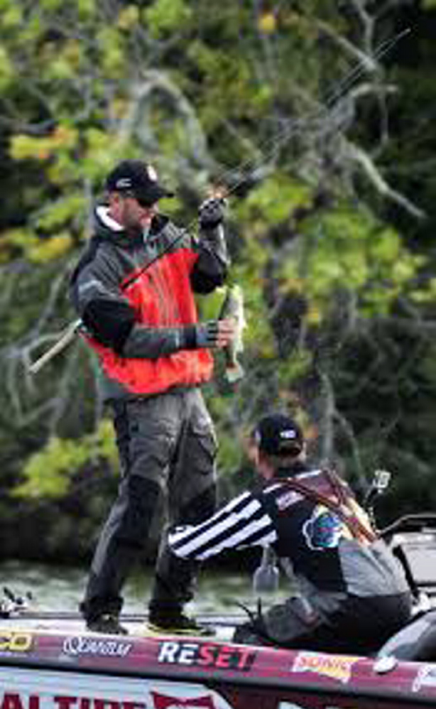 Professional fisherman Aaron Martens casts on China Lake during taping of a Major League Fishing event last summer. The championship round of the tournament filmed in Belgrade-China area will be aired on the CBS television network on Sunday.