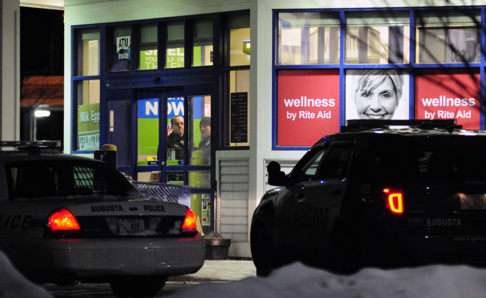 Augusta police officers investigate a robbery around 6:15 p.m.on Saturday at the Rite Aid pharmacy at the corner of North Belfast Avenue and Bangor Street in Augusta.