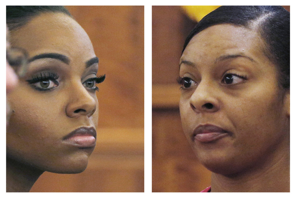 Shayanna Jenkins, left, fiancee of former  NFL football player Aaron Hernandez, listens to her sister Shaneah Jenkins, right, testify during Hernandez’s murder trial at Bristol County Superior Court in Fall River, Mass. Hernandez is accused of the June 2013 killing of Odin Lloyd.