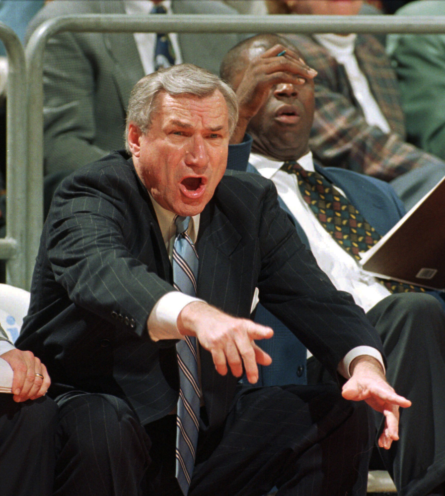 North Carolina head coach Dean Smith yells at his players during ACC basketball action against Florida State in 1997 in Tallahassee, Fla. Smith, the North Carolina basketball coaching great who won two national championships, died “peacefully” at his home Saturday night the school said in a statement Sunday from Smith’s family. He was 83.