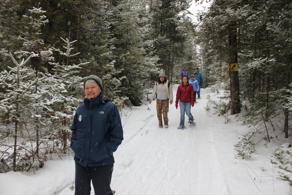 From left are Christie Saunders, Jeanne Siviski, Jennifer Lawton, Jessie Huff, Linda Hartkopf and James Huff on the winter trails at Kanokolus Bog Preserve in Unity.