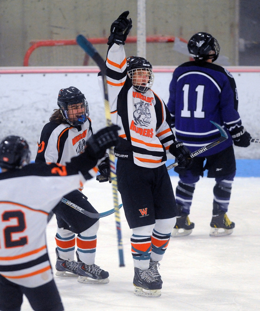 Winslow High School’s Jimmy Fowler points to the sky after scoring a goal Wednesday against Waterville in the first period at Sukee Arena in Winslow. Fowler’s mother passed away Tuesday morning after a lengthy battle with cancer.