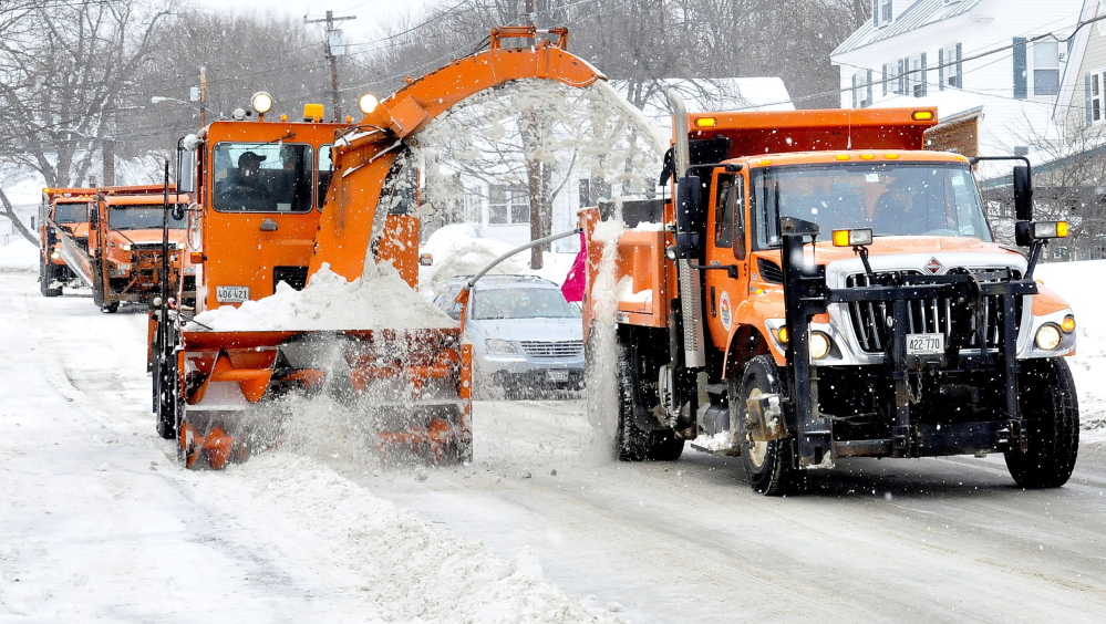 Waterville Public Works employees and equipment were out removing snow from city streets Thursday. The area will get hit with more than a foot of snow this weekend as a blizzard slams the region.
