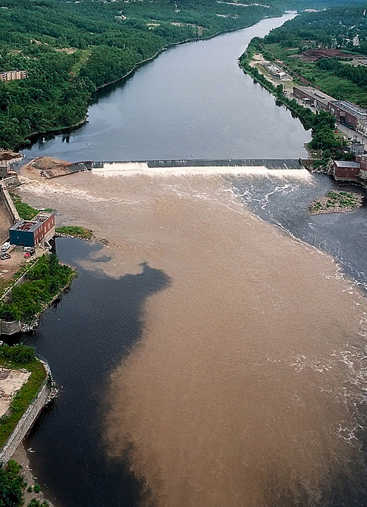 This 1999 file photo shows the Kennebec River clouded with dirt and silt as the rushing waters from the upper section of the river flow freely through the breach in Edwards Dam in July 1999.