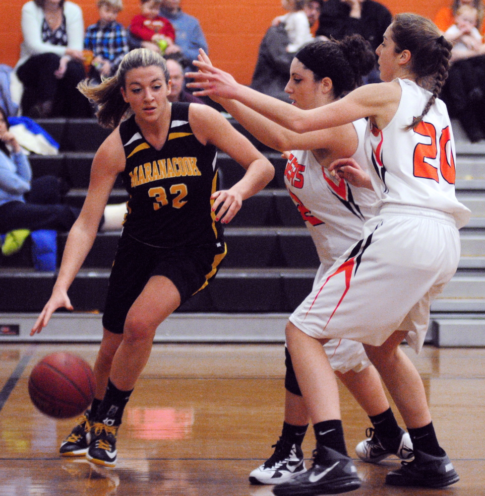 Maranacook’s Christine Miller, left, is double-teamed by Gardiner’s Savannah Vinton-Mullens and Mary Toman during a game earlier this season in Gardiner. The top-seeded Black Bears take on No. 9 Carrabec in a quarterfinal matchup at 8:30 tonight.