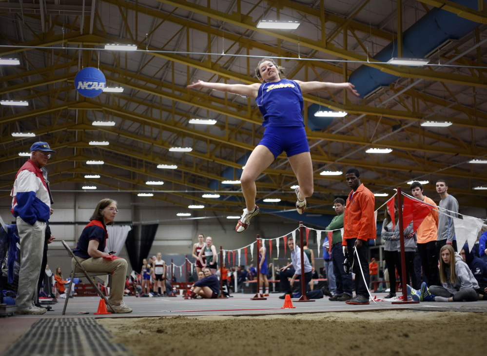 Kate Hall of Lake Region competes in the long jump Monday during the Class B indoor track and field championship meet.