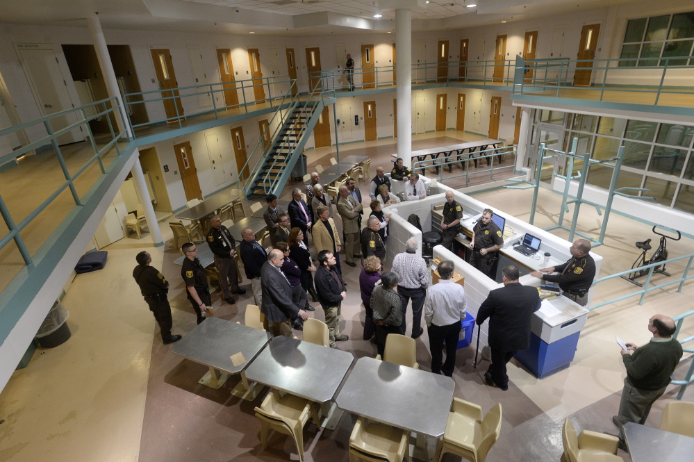 Legislators and county officials take a tour of a pod in the Cumberland County Jail on Jan. 26, 2015.