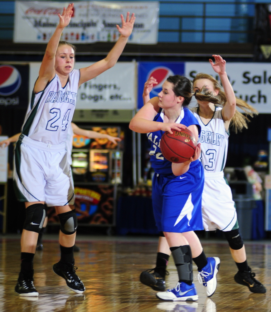Staff photo by Joe Phelan 
 Rangeley defenders Natasha Haley, left, and Maddison Egan, right, double team Valley junior guard Jordan Belanger during a Western D quarterfinal Tuesday at the Augusta Civic Center.