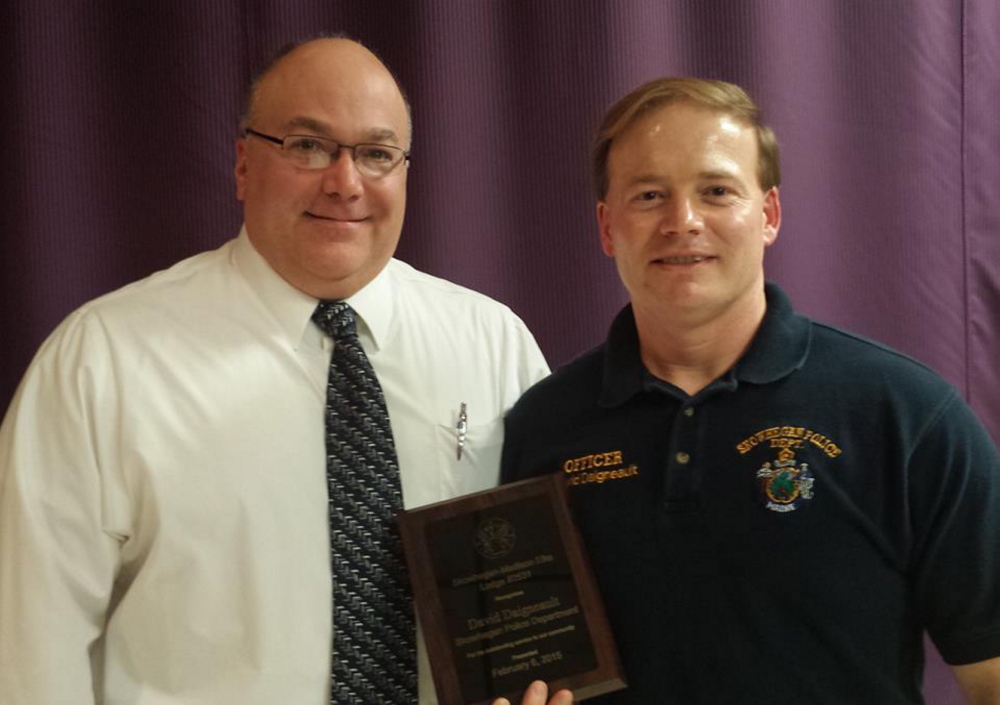 Chief Ted Blais, left, presents and Officer Dave Daigneault with the Officer of the Year Award.