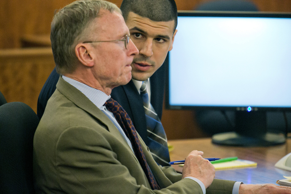 Former NFL player Aaron Hernandez, right, consults with defense attorney Charles Rankin during his murder trial at the Bristol County Superior Court in Fall River, Mass., on Wednesday. Hernandez is accused in the June 17, 2013, killing of Odin Lloyd, who was dating his fiancée’s sister.