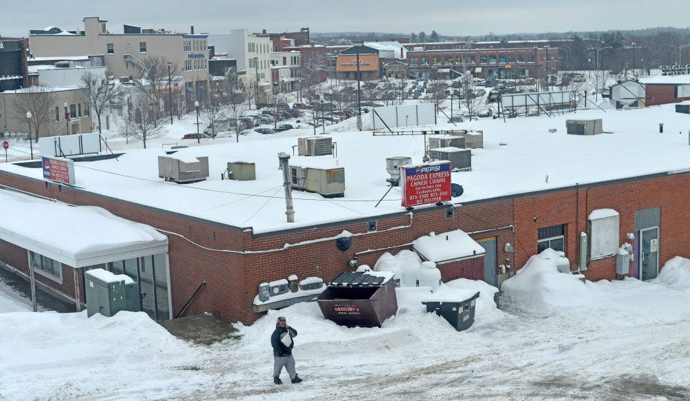 The HVAC units on top of the businesses at The Concourse in Waterville are seen cleared of snow Thursday.
