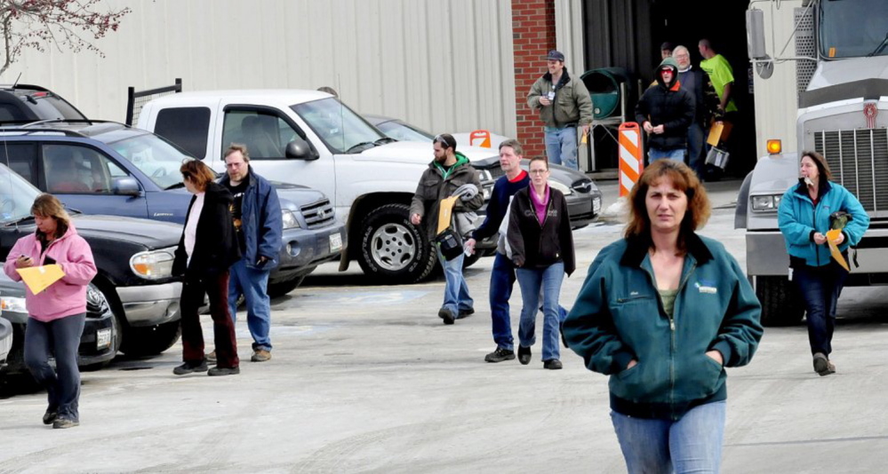Employees leave UTC Fire & Security in Pittsfield last March after hearing the news that the company would close this winter. Company officials say it will be a few weeks before all activities at the plant are wound down.