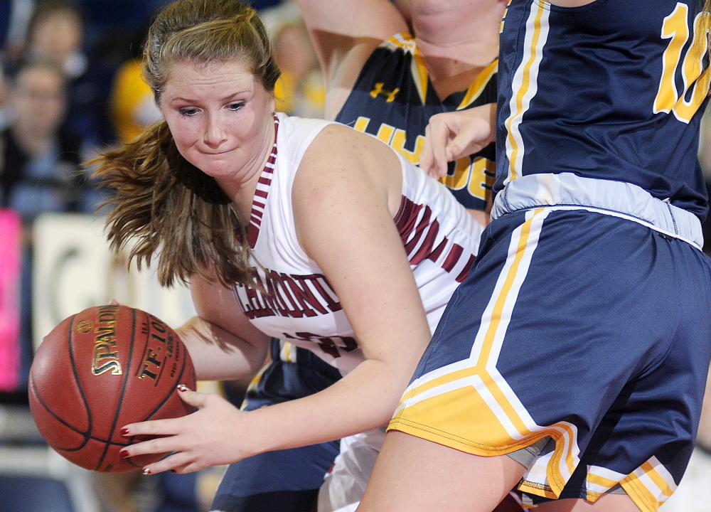 Richmond High School’s Kelsea Anair is sandwiched by a Hyde defender during a Western D quarterfinal game Tuesday morning at the Augusta Civic Center.