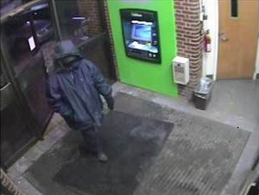 Bank robber seen in surveillance photograph at the TD  Bank in downtown Waterville which was robbed on Feb. 12. He is suspected in three other bank robberies in the area.