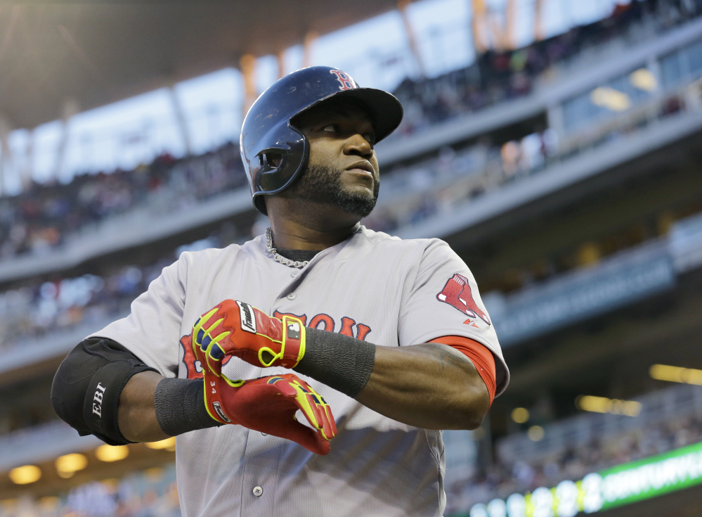 In this May 2014 file photo, Boston Red Sox designated hitter David Ortiz prepares to bat during the fourth inning of a game against the Minnesota Twins in Minneapolis. Major League Baseball is making some changes to speed up the length of games but it won’t implement some of the more radical proposals to make games shorter.